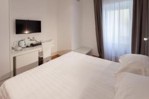 Posteľ alebo postele v izbe v ubytovaní Melody Suite Rome
