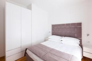 Posteľ alebo postele v izbe v ubytovaní Melody Suite Rome