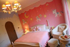 Postel nebo postele na pokoji v ubytování Flower Happiness Homestay