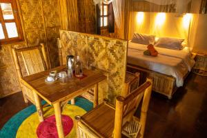 Postel nebo postele na pokoji v ubytování Amihan Beach Cabanas