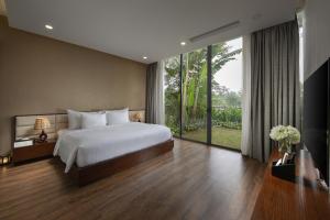 
Giường trong phòng chung tại Flamingo Dai Lai Resort
