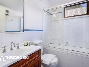a bathroom with a toilet and a sink and a shower at Granite Peaks 4 in Thredbo