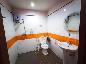 a bathroom with a toilet and a sink at The Moon House in Chiang Mai