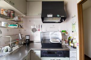 Kuchyň nebo kuchyňský kout v ubytování ゲストハウスTSUU小田原 Guest House Tsuu Odawara #OD1