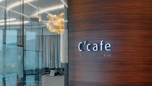 a door with the name of a restaurant and bar at LOTTE City Hotel Gimpo Airport in Seoul