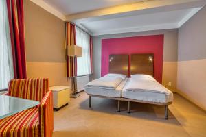 Postel nebo postele na pokoji v ubytování Hotel Goldene Krone