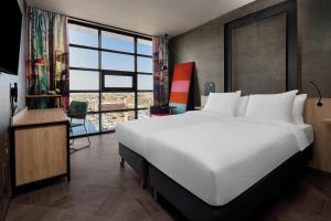Postel nebo postele na pokoji v ubytování Inntel Hotels Amsterdam Landmark