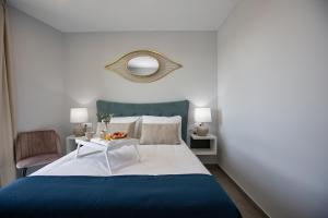 Posteľ alebo postele v izbe v ubytovaní Apartamentos Ribera 19