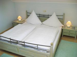 Katil atau katil-katil dalam bilik di Ferienwohnungen Eleonore