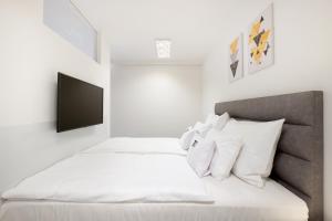 Posteľ alebo postele v izbe v ubytovaní Divat Apartments - Central Smart Homes