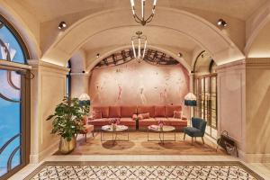 uma representação de uma sala de estar com um sofá em Hotel MOTTO em Viena