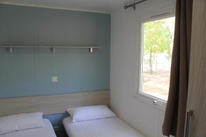 Cama o camas de una habitación en Camping La Fundicion