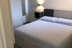 Кровать или кровати в номере Pelosa - Capo Falcone Excellent Apartment