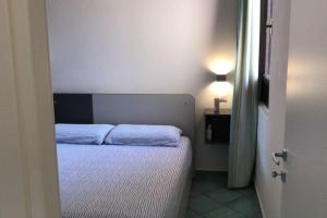 Кровать или кровати в номере Pelosa - Capo Falcone Excellent Apartment