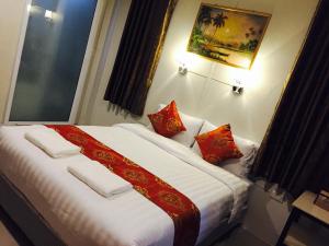 Кровать или кровати в номере Apinsaya House