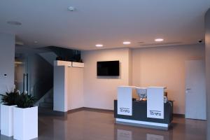 TV i/ili multimedijalni sistem u objektu Hotel Tempo