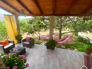 an outdoor patio with chairs and a table at Lina Vranković Apartments in Hvar