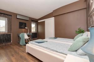 Posteľ alebo postele v izbe v ubytovaní Nightingale Luxury Apartment