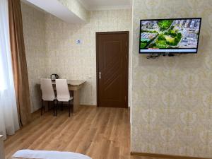 Sjónvarps- og/eða afþreyingartæki á Hotel Sharl