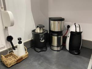 a kitchen counter with a coffee maker and other appliances at Casa BLANKA Bahia Playa Anlage Costa Calma in Costa Calma