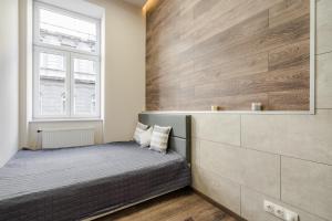 Krevet ili kreveti u jedinici u okviru objekta Central comfort suite for 6 by Oktogon
