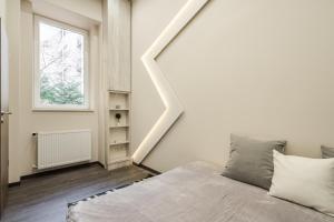 Krevet ili kreveti u jedinici u okviru objekta Central comfort suite for 6 by Oktogon