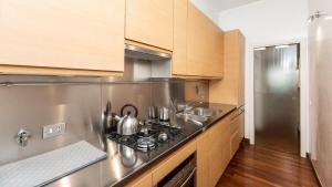 A kitchen or kitchenette at Cartari Rental in Rome Apartment