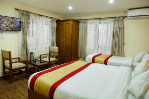 Voodi või voodid majutusasutuse Kathmandu Garden Home toas