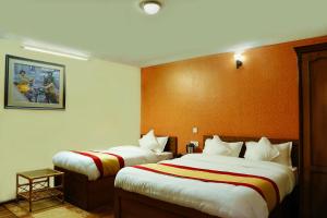 Voodi või voodid majutusasutuse Kathmandu Garden Home toas