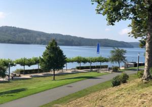 a park with a view of a lake and a road at APARTAMENT ''MARGARITA'' - Langscheid in Sundern