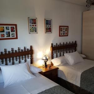Cama o camas de una habitación en Habitaciones en El Sardinero-Santander