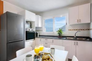 a kitchen with a table with a plate of food on it at Casa Buenavista in Hoya de Pineda