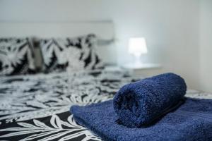 a blue towel sitting on top of a bed at Casa Buenavista in Hoya de Pineda +17 photos