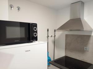 Kuchyňa alebo kuchynka v ubytovaní Apartamentos Hi Apartaments Santander 3000