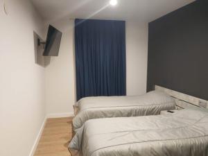 Posteľ alebo postele v izbe v ubytovaní Apartamentos Hi Apartaments Santander 3000