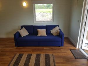 Posezení v ubytování Crag Na Cor Log Cabin