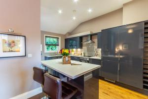 a large kitchen with a large island in the middle at Middlethorpe Manor - No1 Relax and Unwind in York