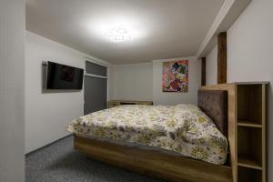 Ένα ή περισσότερα κρεβάτια σε δωμάτιο στο Apart Hotel Fusion