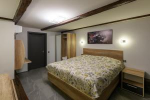 Ένα ή περισσότερα κρεβάτια σε δωμάτιο στο Apart Hotel Fusion