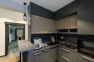 Η κουζίνα ή μικρή κουζίνα στο Apart Hotel Fusion