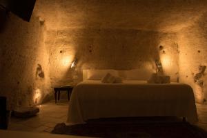 A bed or beds in a room at LA DIMORA DELLE 3 ZIE