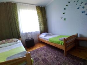 Posteľ alebo postele v izbe v ubytovaní Przy Starej Lipie