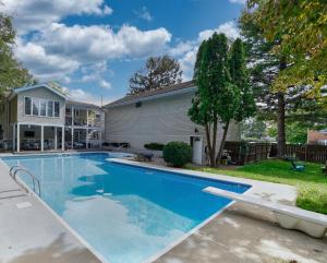 a swimming pool in the backyard of a house at A Modern Apt close to downtown in Lancaster