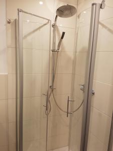 a shower with a glass door in a bathroom at Südanker - a58933 in Fehmarn