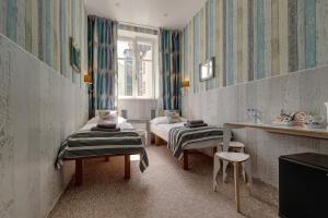 Posteľ alebo postele v izbe v ubytovaní Royal Court Hotel