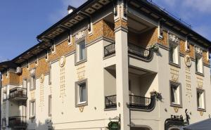 a building with balconies on the side of it at Economy room in Hotel Eney in Lviv