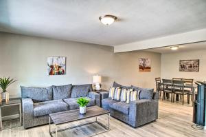 a living room with a couch and a table at Stylish and Central Mesa Home with Private Pool! in Mesa