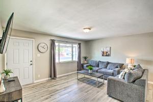 a living room with a couch and a table at Stylish and Central Mesa Home with Private Pool! in Mesa