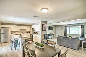 a kitchen and living room with a table and chairs at Stylish and Central Mesa Home with Private Pool! in Mesa