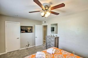 a bedroom with a ceiling fan and a bed at Stylish and Central Mesa Home with Private Pool! in Mesa